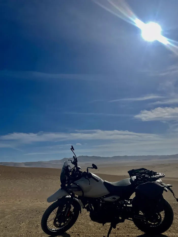 Last leg, headlights on — riding into the night